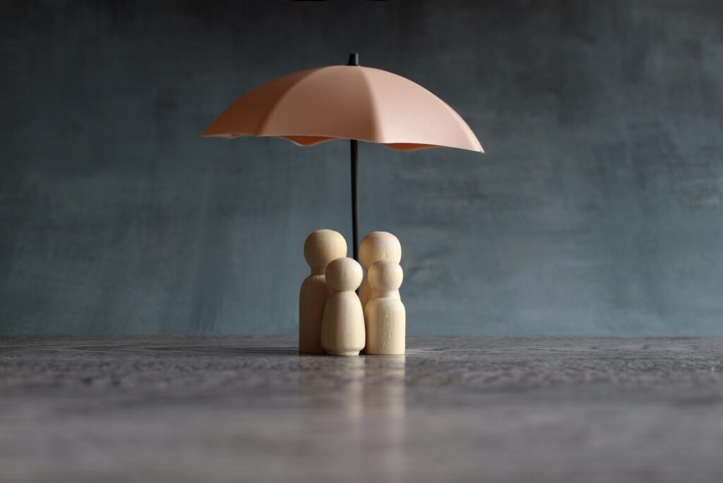 umbrella-and-wooden-dolls-with-copy-space-2023-11-27-05-28-52-utc